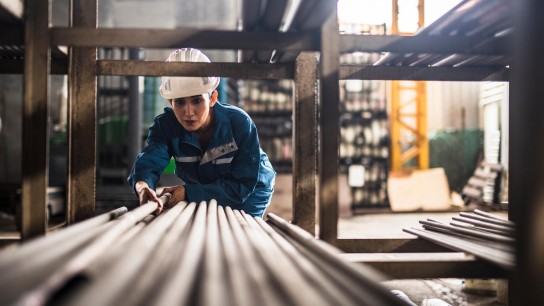 Warehouse employees are sorting production components