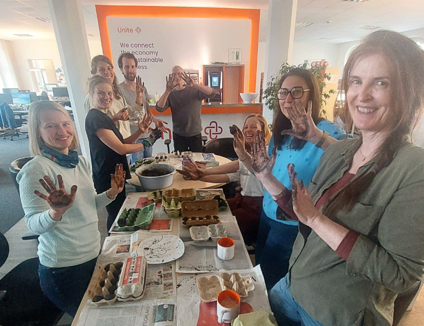 a group of Unitees make seed bombs for distribution